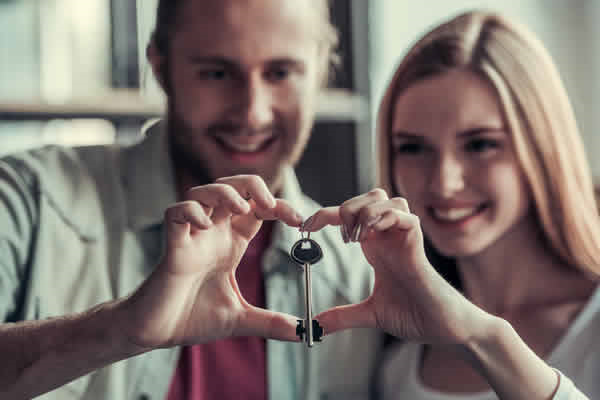 Couple holding key
