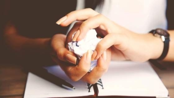 Hand with wad of paper