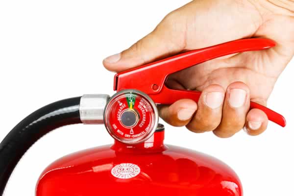 Picture of hand holding fire extinguisher