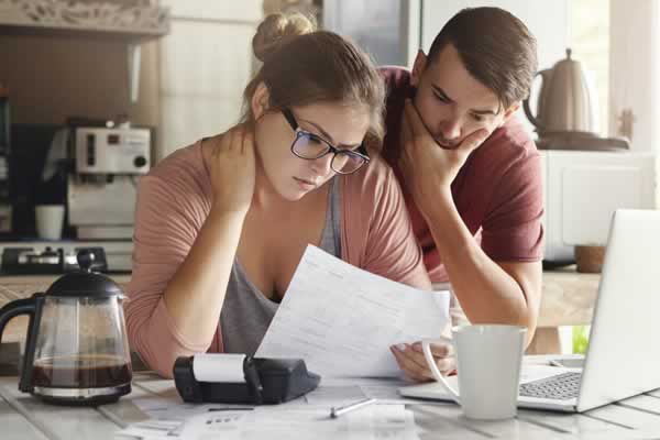 Man and woman looking at sheet of paper