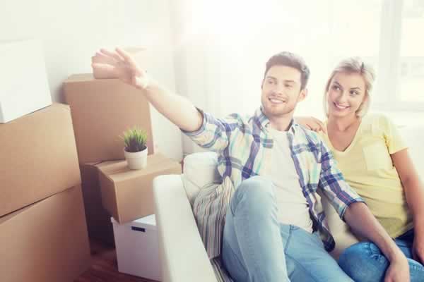 Couple on sofa smiling