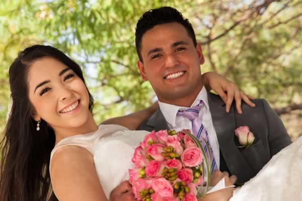Groom carrying bride