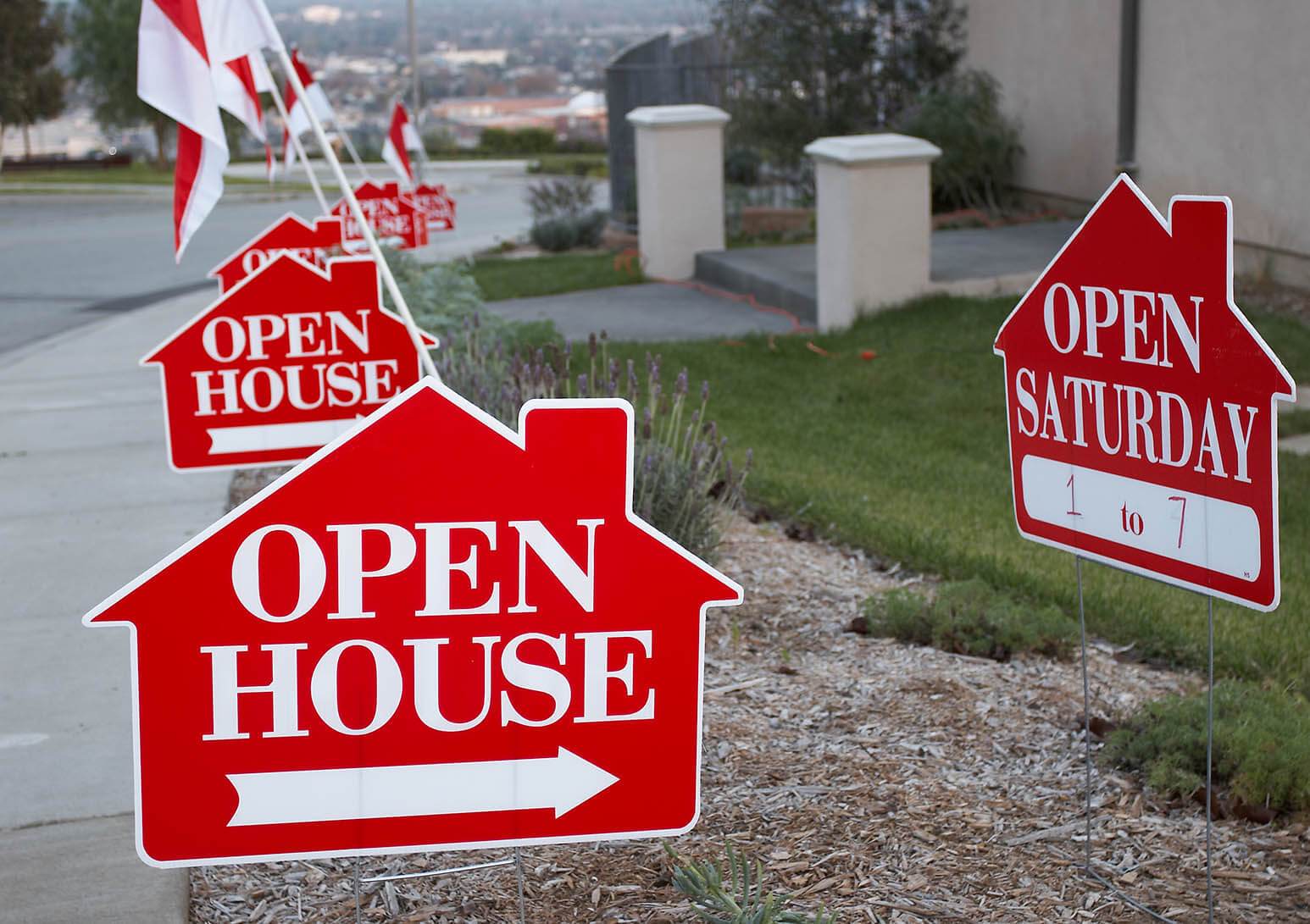 Open house signs on lawn
