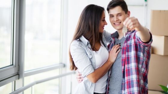 Woman hugging man with keys