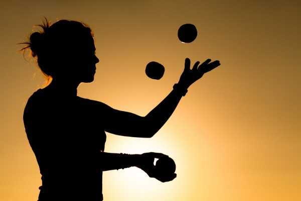 Woman juggling balls