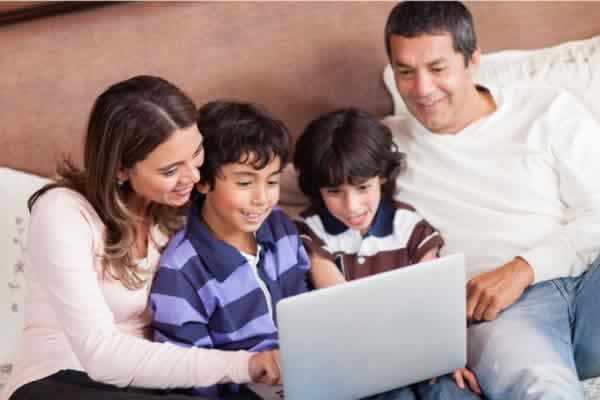 Family looking at laptop screen