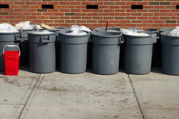 8 Garbage cans along wall