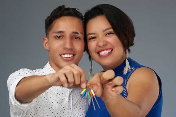 Man and woman holding keys
