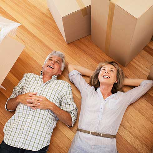 Older couple lying on floor dreaming